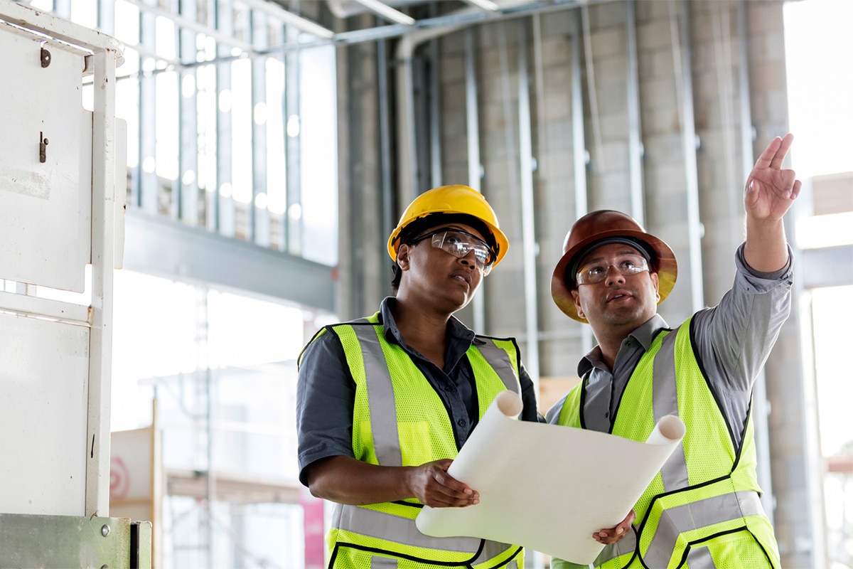 Building Officials Pointing At Site