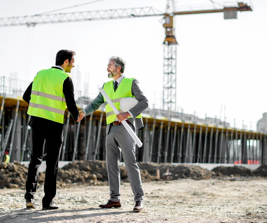CGA employees shaking hands
