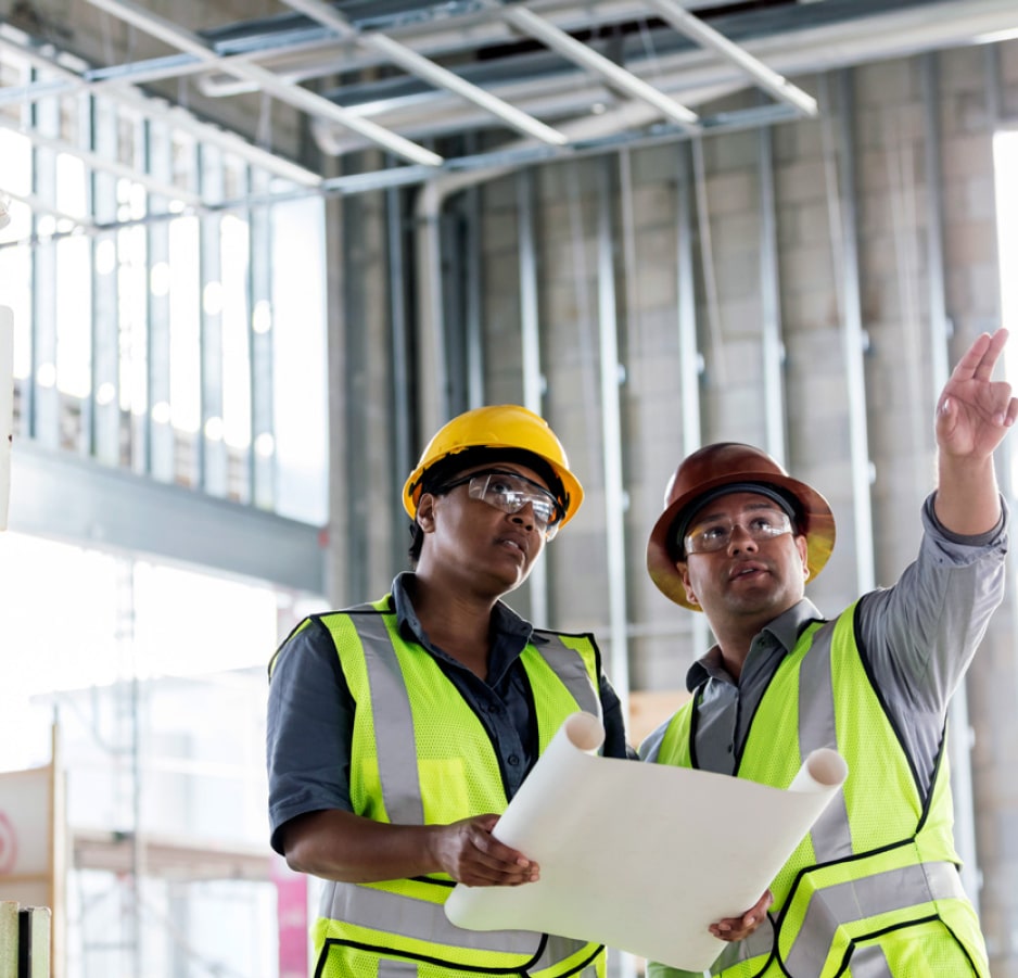 Two workers pointing