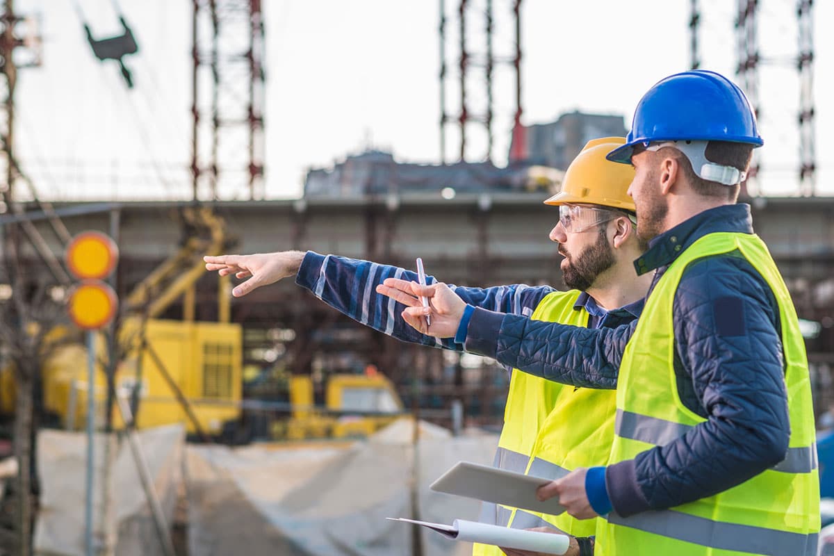 Workers at site pointing